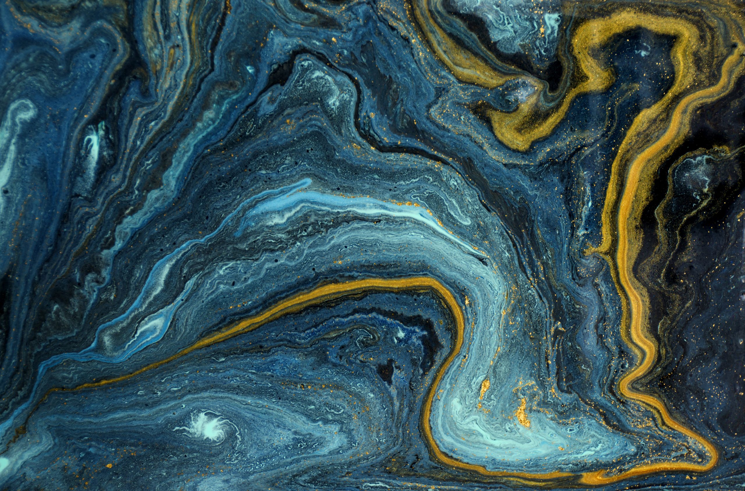 Marble abstract acrylic background. Blue marbling artwork texture. Agate ripple pattern. Gold powder. Gold Bhams